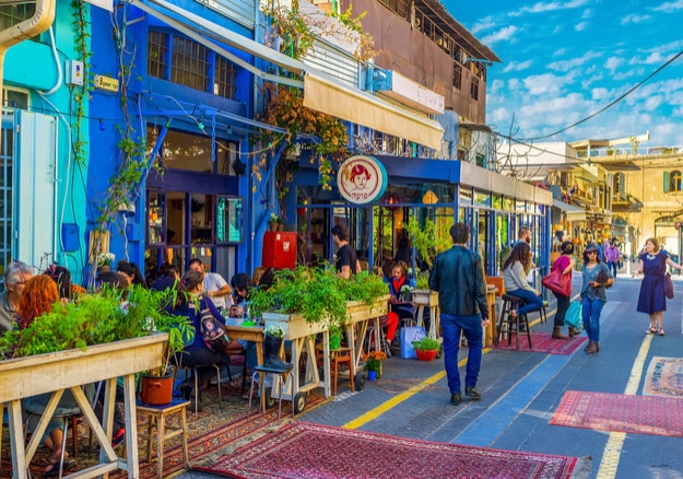 The flea market neighborhood of old Jaffa is full of the cozy cafes, decorated with plants in pots, colorful rugs and wooden details