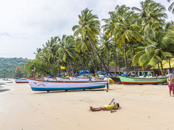 Girl reading on the Colva beach in Goa - Goa