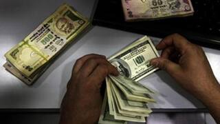 Rupee hits high at 60.33; closes at 60.49 vs dollar