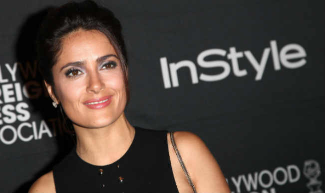 Salma Hayek avoids wardrobe malfunction during a photoshoot