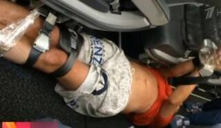 Drunken man in Siberia Airlines plane beaten up and tied to seat by co-passengers! Watch video