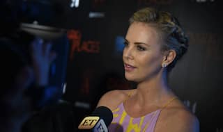 Charlize Theron happy to hit 40