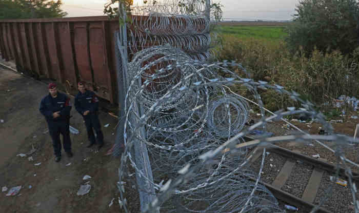 Hungary police fire tear gas at migrants at Serbia border