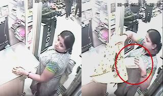 Woman steals smartphone from under the vendor's nose!