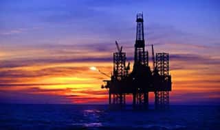 Oil prices slide as output cut hopes fade