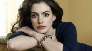 Anne Hathaway flaunts baby bump for first time