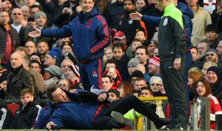Manchester United manager Louis van Gaal tumbles on touchline in front of official [Watch Video]