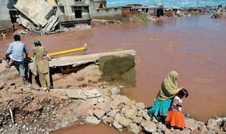 Rescuers race to reach thousands stranded by rains in Pakistan
