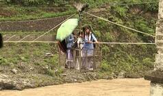 Uttarakhand rains: Students use rope trolley to cross flooded Alaknanda river