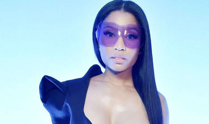 Nicki Minaj puts on a VERY busty display in plunging leather corset at  Versace MFW show
