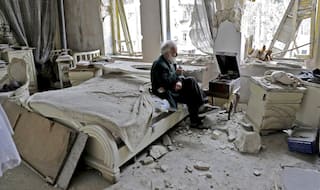 Viral: This distressing picture of Aleppo man sitting in shattered home has become a symbol of Syria's civil war