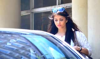 A tense looking Aishwarya Rai Bachchan takes a quick break from her hospital duty to spend some time with Aaradhya - view HQ pics