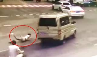 CCTV footage shows man jumping out of moving van in China moments before it catches fire
