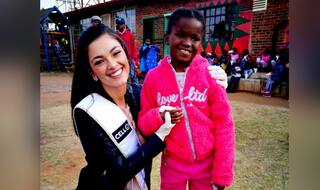 Miss South Africa Demi-Leigh Nel-Peters Called Racist For Wearing Gloves While Feeding Children at Orphanage