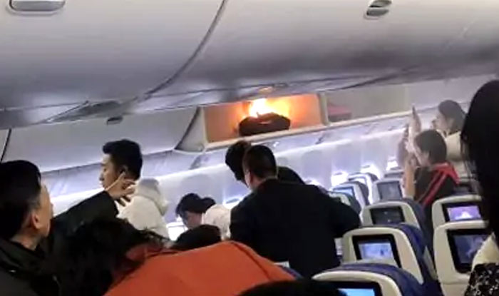 China Man Opens Plane S Emergency Door To Get Fresh Air Detained
