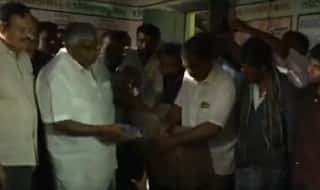 Karnataka Floods: Video of PWD Minister HD Revanna Throwing Biscuits at Hungry Victims Goes Viral - Watch Here
