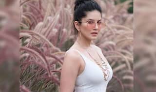 Sunny Leone is in no Mood to Giveaway Her Summer Vibes Yet as She Poses in White Top And Pink Shorts