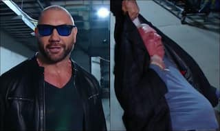 WATCH| Batista Returns to WWE RAW, Attacks Ric Flair to Draw Triple H's Attention