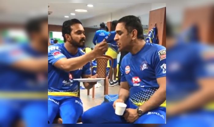 Image result for jadhav giving food to Dhoni