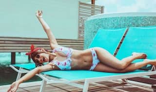 Karishma Sharma Turn up The Heat in Floral Bikini as She Happily Poses on The Beach Lounger in Maldives