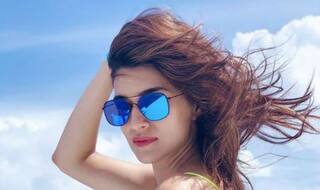 Kriti Sanon Looks Hot in Neon Tank Top And Denim Shorts as She Takes Yatch Ride in Maldives