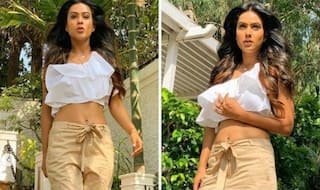 Nia Sharma 'Don't Mind The Tan' as She Walks in The Sun Like a Boss in White Crop Top And Beige Trousers