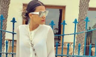 Nia Sharma Raises The Hotness Quotient in White Sheer Dress And Blue Boots
