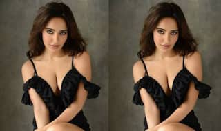 Neha Sharma's Sunday is All About Hot Picture in Black Dress With Plunging Neckline