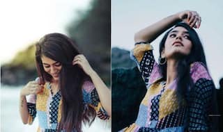 Priya Prakash Varrier in a Multi-colour Dress Poses Sensuously at Beachside