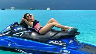 Bollywood Hotness Nushrat Bharucha Flaunts Her Washboard Abs in Sexy Pink-Black Bikini as She Rides Jet Skii in Maldives