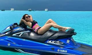 Nushrat Bharucha Flaunts Her Washboard Abs in Pink-Black Bikini as She Rides Jet Skii in Maldives