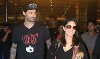 Sunny Leone's Husband Daniel Weber Cannot Get His Eyes Off Her as They Walk Hand-in-hand at Mumbai Airport