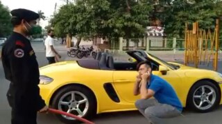 Indore Man Driving Porsche Made to Do Sit-Ups on Road For Not Wearing a Mask | Viral Video