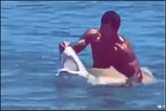 Swimmer Posing in The Ocean With Shark's Jaw Pulled Wide Open Will Surely Send Shivers Down Your Body