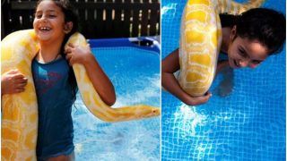 Watch It to Believe It! This 8-Year-Old Israeli Girl Loves Swimming With Her 11-Foot Pet Python, The Internet is Scared