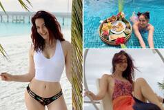 Elli AvrRam Flaunts Flawless Body in a White Crop Top and Printed Bikini Bottoms While Reminiscing Memories from Maldives