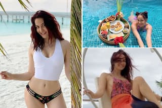 Elli AvrRam Flaunts Flawless Body in a White Crop Top and Printed Bikini Bottoms While Reminiscing Memories from Maldives