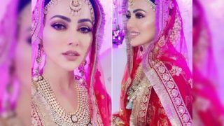 Sana Khan Is A Gorgeous New Bride In Rs 99K Red and Golden Lehenga For Her Walima