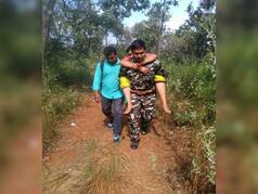 Andhra Constable Carries Elderly Devotees on His Back After They Faint During Tirupati Trek