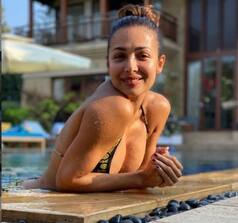 Malaika Arora Gives Rare Peek of Her Pool Time, Poses in Printed Black-Yellow Bikini