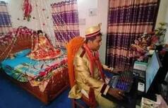 Gone Viral: This Photo of Groom Sitting at Computer on Wedding Night While Bride Waits For Him!