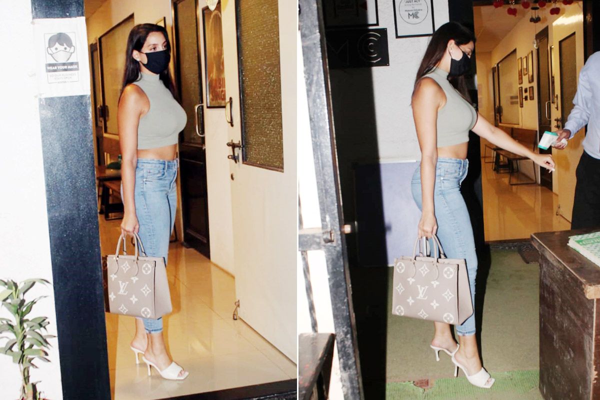 Nora Fatehi in chic top and denims with Louis Vuitton sling bag is