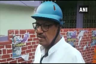 #WestBengalElections2021 LIVE: TMC-BJP कार्यकर्ताओं के बीच हिंसक झड़प, हेल्मेट पहन वोट देने पहुंचे ममता के मंत्री