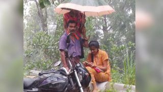 Man Holds Umbrella Over Daughter As She Attends Online Classes Amid Rain, Picture Wins Hearts