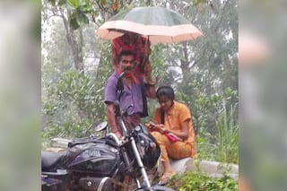 Man Holds Umbrella Over Daughter As She Attends Online Classes Amid Rain, Picture Wins Hearts