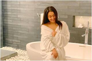 Neha Kakkar Poses in a Bathrobe, Husband Rohanpreet Singh Gets Blown Away | See Pics