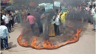 TDP Workers Protest Against Fuel Price Hike By Standing Inside Ring Of Fire In Andhra Pradesh | Watch