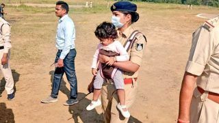 Photo of Woman Cop Carrying Toddler Daughter to Duty at Helipad Goes Viral, Wins MP CM's Praise