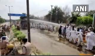 Police Use Water Cannons During Clash With Farmers in Haryana's Jhajjar | WATCH