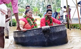 Viral Video: Kerala Bride & Groom Reach Flooded Wedding Venue in Cooking Vessel | Watch